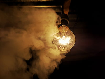 incandescent bulb surrounded by smoke thumbnail