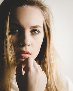 woman wearing silver-colored nose piercing thumbnail