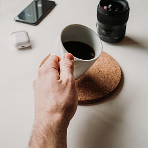 person holding white ceramic mug thumbnail