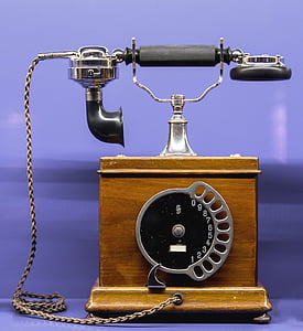close-up photography of gray and brown cradle home phone thumbnail