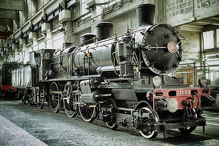 black and red train near buildings thumbnail