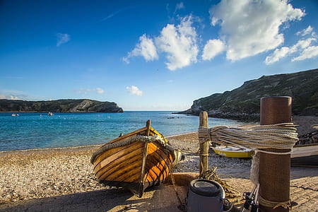 brown boat on the shore thumbnail