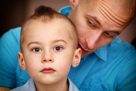 man in blue button-up shirt and boy in blue button-up shirt thumbnail