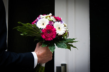 man holding bouquet of flowers thumbnail