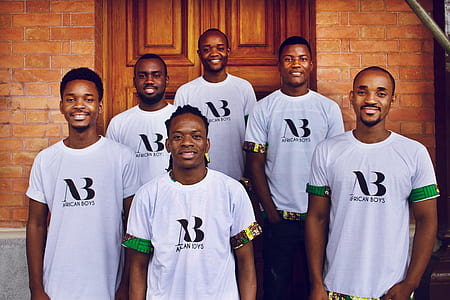 six men wears white AB t-shirt standing near brown wooden door thumbnail