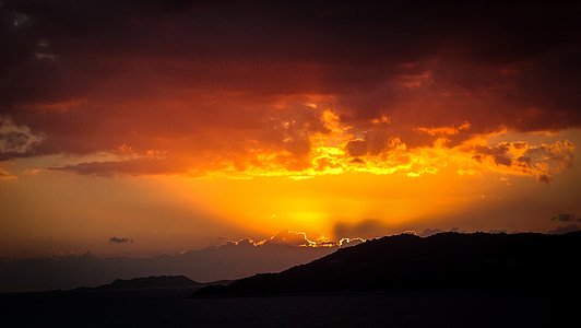 sunlight piercing through clouds during golden hour thumbnail