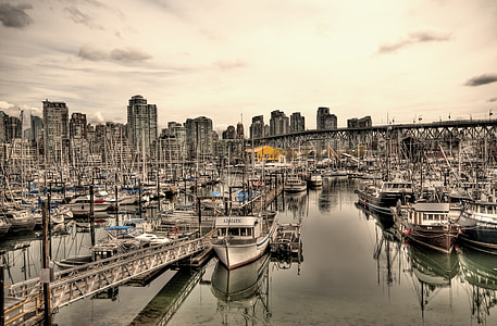 cityscape photography of bridge and boat thumbnail