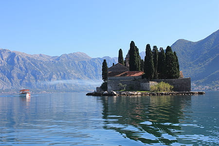 island on the center of body of water thumbnail