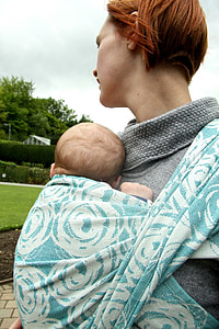 woman carrying a baby thumbnail