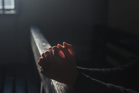person praying hands selective focus photographyt thumbnail