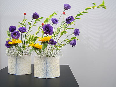 two purple rose flowers and yellow sunflowers in beige vase centerpieces thumbnail