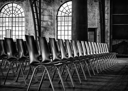 grayscale photography of armless chairs thumbnail