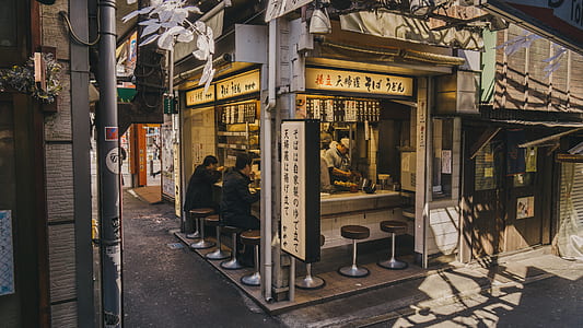 two man eating at food store thumbnail