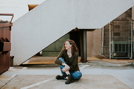 woman sitting on floor beside stairway thumbnail