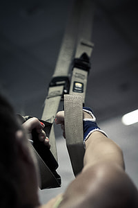 person pulling gray straps thumbnail