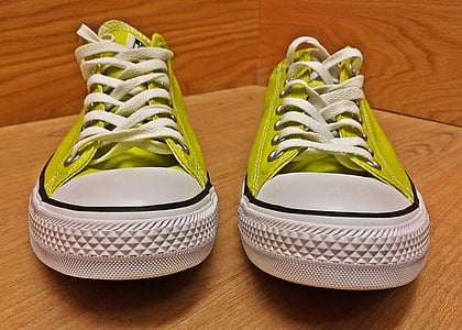 pair of green Converse All-Star low-top sneakers on wooden surface thumbnail