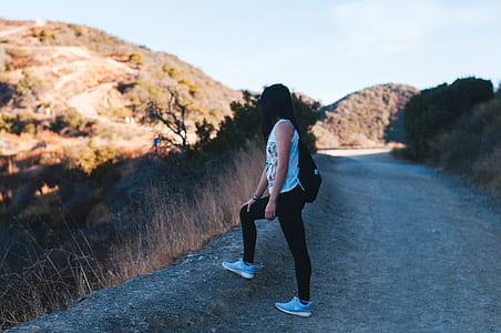 woman standing on top of hill thumbnail