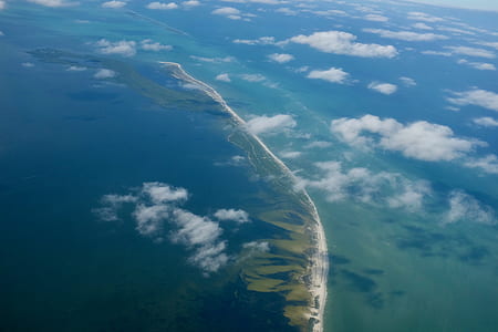 aerial photography of clouds and mountains thumbnail