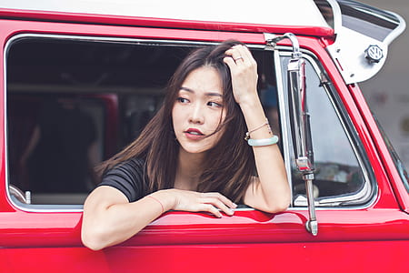 sitting woman inside vehicle at daytime thumbnail