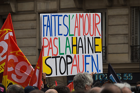 person raising multicolored signboard thumbnail