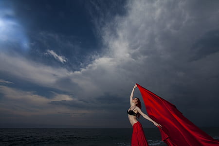 woman holding red banner thumbnail
