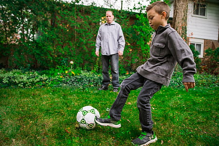 Father And Son Playing Soccer Photo thumbnail