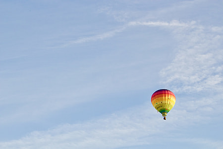 yellow and red hot-air balloon in flight thumbnail