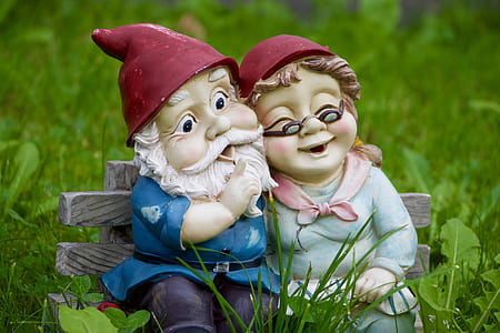 male and female dwarf seating on gray bench chair figurine thumbnail