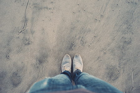 person standing on sand thumbnail