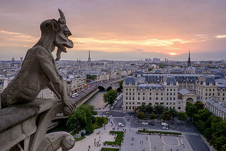 grey gargoyle statue facing downtown thumbnail