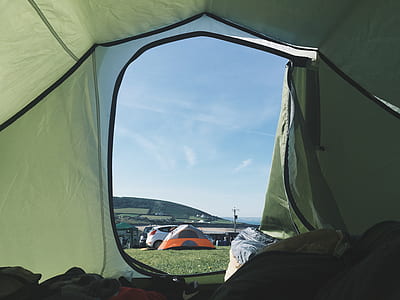 green dome tent in green field thumbnail
