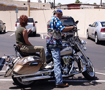 man and woman riding touring motorcycle thumbnail