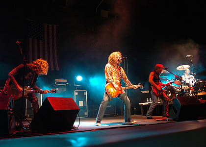 band of people playing on stage thumbnail