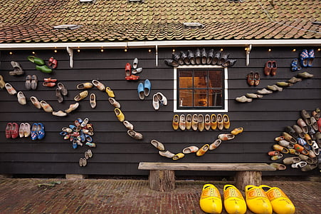 clog shoes on wall thumbnail