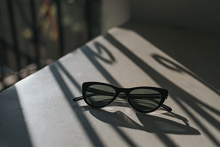 black sunglasses on table thumbnail