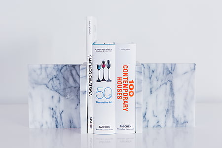 assorted-title book on white surface thumbnail