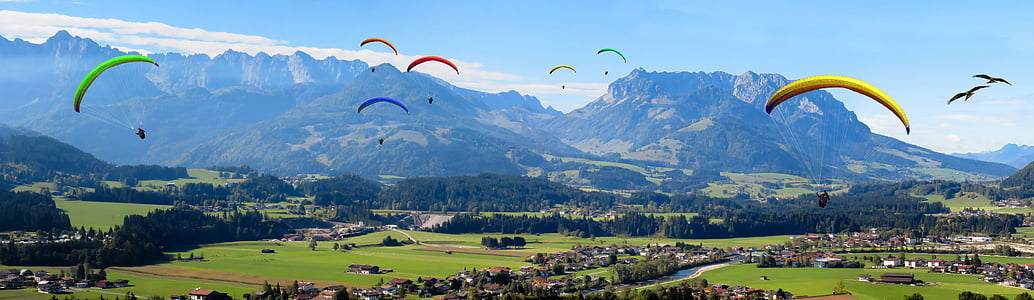 people under assorted parachutes during daytime thumbnail