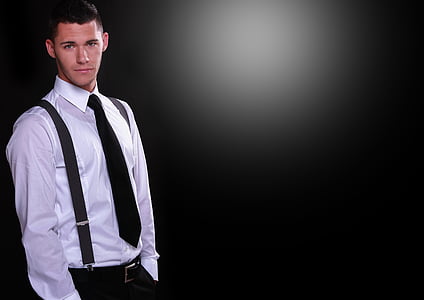 man wearing black necktie, white dress shirt, and black dress pants thumbnail