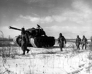 A column of the U.S. 1st Marine Division move through Chinese lines, Battle of Chosin Reservoir thumbnail