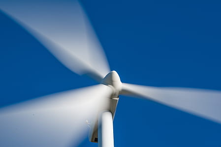 white windmill under blue sky during daytime thumbnail