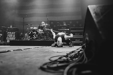 grayscale band playing on stage thumbnail