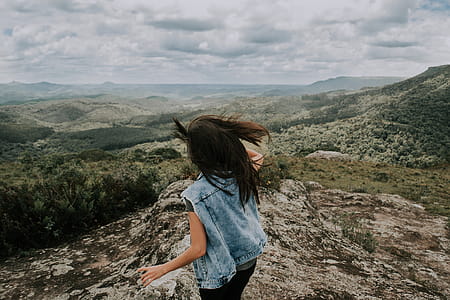 Woman in Blue Denim Vest Standing thumbnail