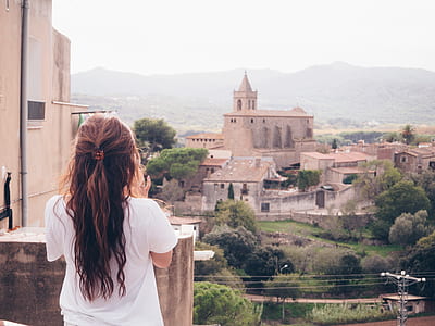 woman facing backward looking at castle thumbnail