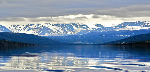 body of water near mountain thumbnail