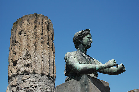 human statue beside pillar thumbnail
