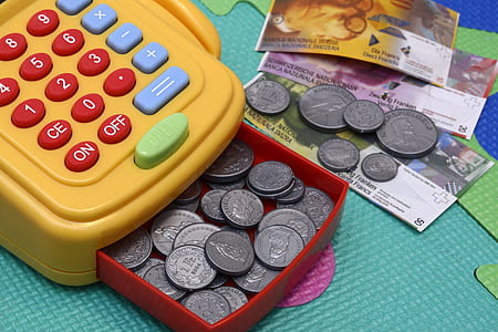 orange and red credit card terminal with coin toy thumbnail