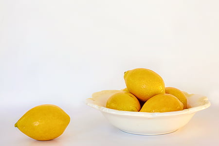 several lemons on white ceramic bowl thumbnail