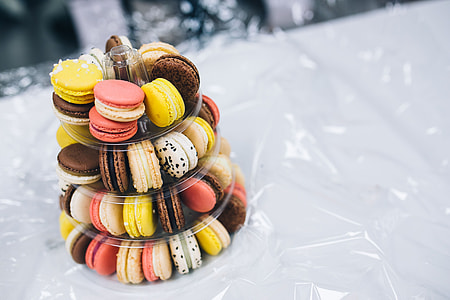 Colourful sweet macarons arranged in a tower thumbnail