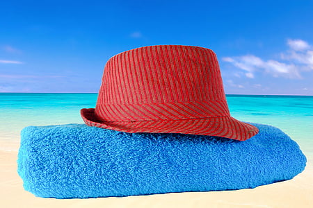 red hat on blue bath towel thumbnail