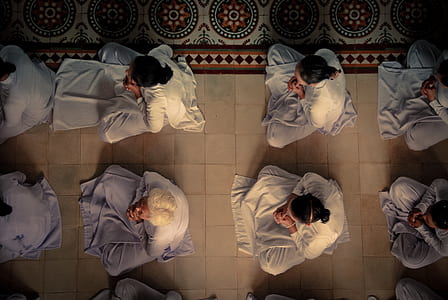 top view photo of people sitting on floor thumbnail